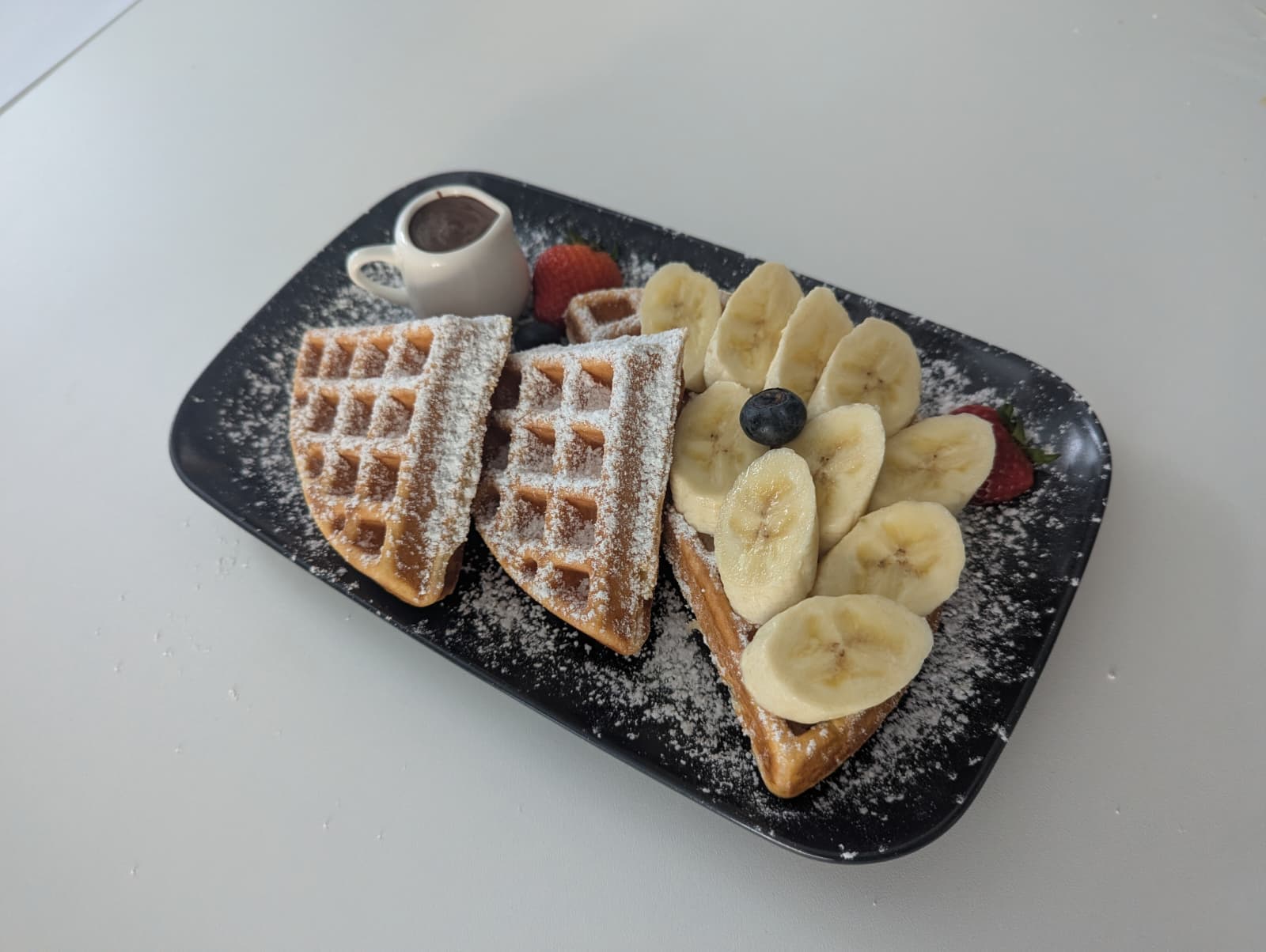 Americano waffles with banana, berries & chocolate